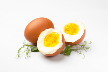 Hard boiled eggs and microgreens on white background