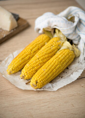 Vegan snack of boiled corn with parmesan for lunch