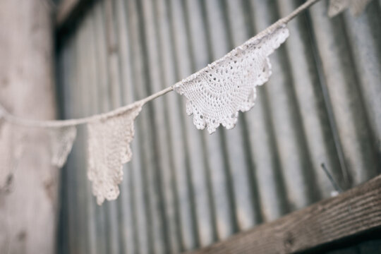 doily bunting in a rustic tin shed