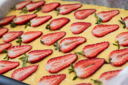 white chocolate blondie with fresh strawberries, before going into the oven