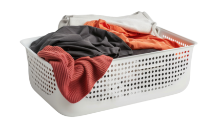 Laundry basket filled with colorful clothes ready for washing at home in a clean environment
