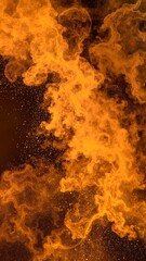 A warm, flickering fire blazes brightly against the backdrop of a dark night, casting dancing shadows and illuminating the surrounding area with a cozy glow.