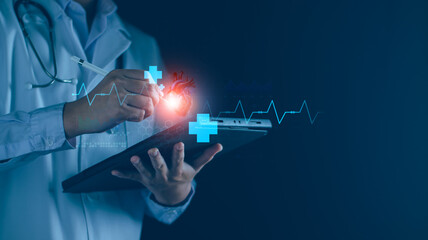Cardiologist doctor hand using tablet examine patient heart functions and blood vessel. Medical...