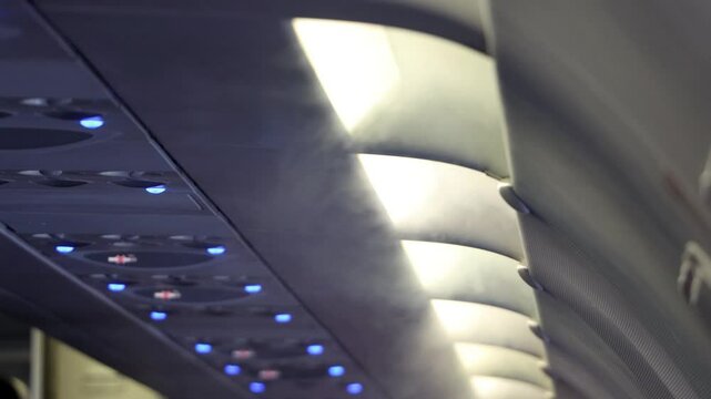 Water vapor pouring down from the air conditioning in the aircraft.