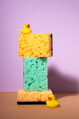 Household sponge foam cleaner still life and bath duck
