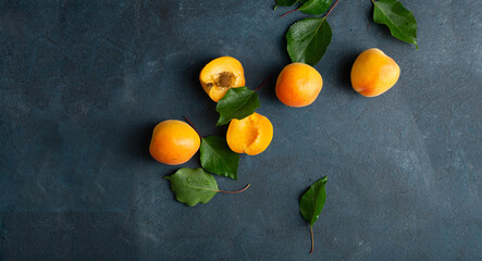 Blue summer fruits background apricots