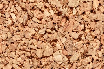 life-size detail of a natural cork sheet with its brown honeycomb structure