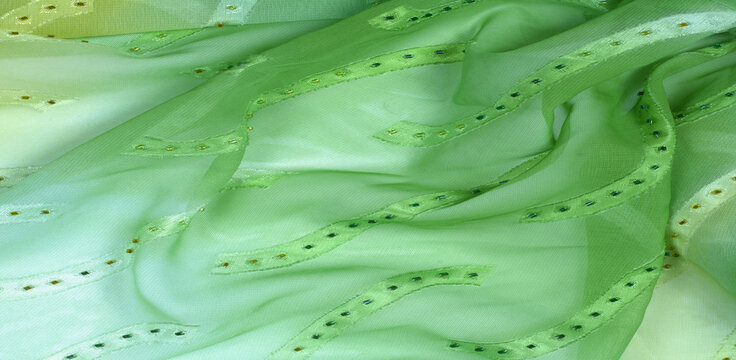 Seamless kaleidoscope. Fabric silk green-blue shades. Vibrant colors and scalloped shapes create a truly unique crepe de chine in yellow, blue and green geometric silk crepe de chine.