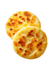Two delicious golden brown flatbreads, lightly toasted and glistening with butter, sit stacked slightly askew against a clean white background providing contrast.