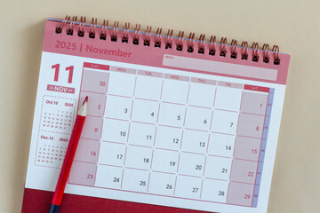 Hello, November 2025. A desktop calendar for planning on the table.