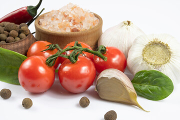 Close-up of vegetables and spices isolated on white background.