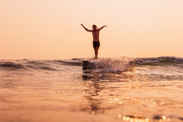 Male surfer on wave. Surfing men on longboard in sea.