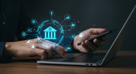 Person using laptop and phone with digital banking interface