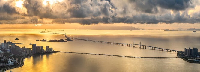 Major sea-crossing bridge connecting islands over the ocean at sunset near Hong Kong and Macau.