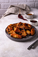 Baked spicy chicken wings with sauce
