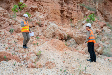 Geologist surveying mine,Explorers collect soil samples to look for minerals, A geologist is a...