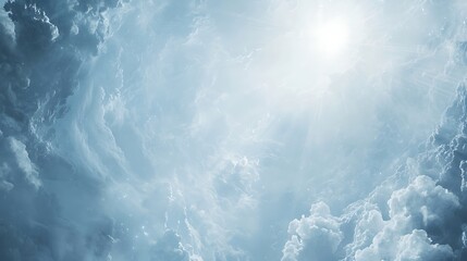 Fluffy white clouds floating in a pale blue sky, with sun rays softly shining through, creating a serene and dreamy atmosphere.