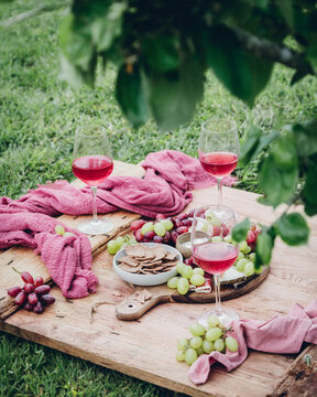 Scenic picnic setting with wine and assorted snacks