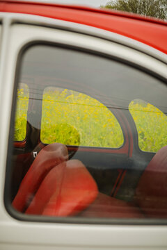 Classic Citroen car with vibrant red interior