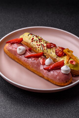 French food, dessert eclair with chocolate filling. Eclair as a background