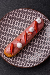 French food, dessert eclair with chocolate filling. Eclair as a background