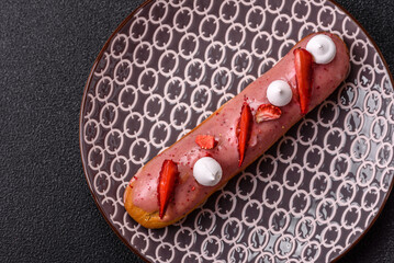 French food, dessert eclair with chocolate filling. Eclair as a background