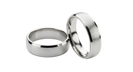 Close-up of two beautifully crafted silver rings, showcasing modern design, perfect for weddings or special occasions transparent background
