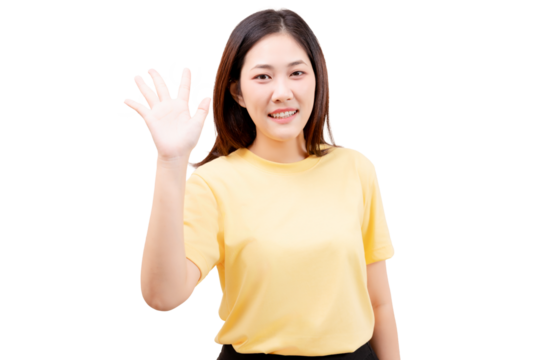 Asian young beautiful smiling in a yellow shirt and waves with her right hand.