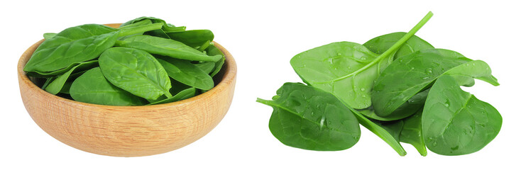 Baby spinach leaves in wooden bowl isolated on white background