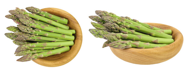 fresh asparagus in wooden bowl isolated on white background. Top view. Flat lay