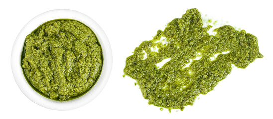 Pesto sauce in ceramic bowl isolated on white background. Top view. Flat lay