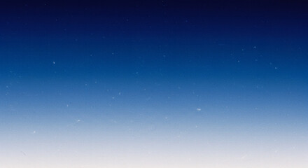 Fototapeta premium Deep blue to white gradient with fine grain texture creates atmospheric sky effect for night-to-day transitions and dreamy landscape backgrounds