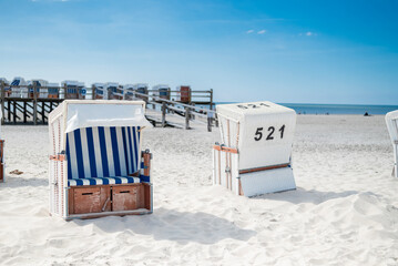 Strandkörbe sun loungers on the northern Germany St. Petersburg - Ording on the shore of the North Sea on the beach for relaxation