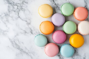 Obraz premium Pastel macarons on white marble with copy space for bakery advertising