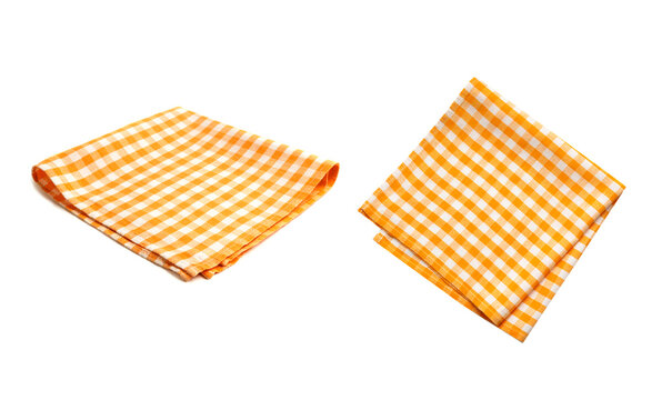 Orange checkered folded kitchen towel set isolayed on white,picnic cloth isolated.