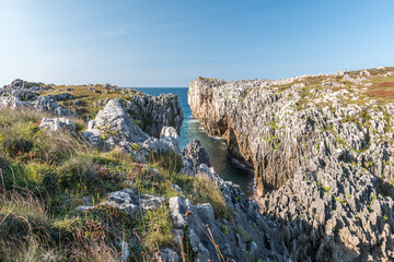 Rocky coastline in the Acantilados de Guadamia area, in Asturias, along the coastline of northern Spain