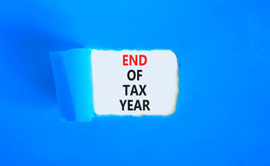 End of tax year symbol. Concept words phrase End of tax year on beautiful white paper. Beautiful...