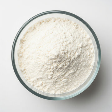 maida flour in borosilicate glass bowl isolated on white background for baking cooking and refined flour ingredient concept