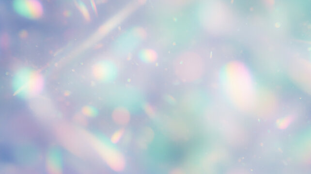 Soft, blurred abstract background with iridescent bokeh light effects in teal, pink, and white. Gentle backdrop for calming digital art or ethereal presentations with a dreamy, sparkling atmosphere.