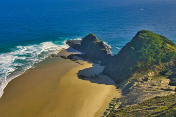 Aerial view of Cape Reinga, the northernmost point of North Island, New Zealand. The Cape is of...