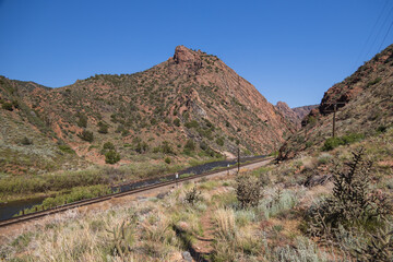 Arkansas River flowing through Royal Gorge Canyon next to railroad tracks, Colorado