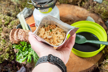 Dried food in a bag. Food for tourists. Food in a sealed bag. Semi-finished product in a bag. Cooking food from a bag. Hold in hand.