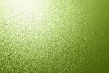 Fototapeta premium Textured green surface with subtle, seamless pattern creates vibrant and fresh appearance, reminiscent of apple skin. light reflection adds glossy effect, enhancing texture depth
