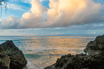 Nature vacation background, sunset at Padang Padang Beach in Bali Indonesia