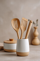 beautifully arranged set of kitchen utensils on wooden table with soft blurred background that highlights details