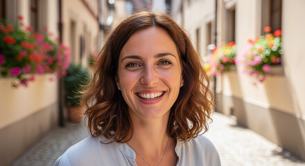 Portrait of a Smiling Woman in a Sunny European Alley
