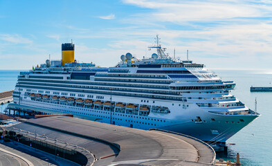 Large Cruise Ship Docked at Port Terminal on a Sunny Day