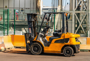 Yellow Industrial Forklift Truck Parked at Loading Area