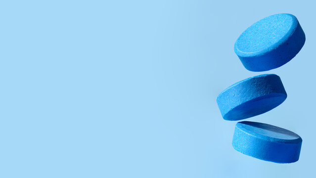 A pair of elegantly posed legs extends from a vintage baroque armchair, partially wrapped in thick black rope. Erotic fashion art style rope Shibari Japanese bondage. 