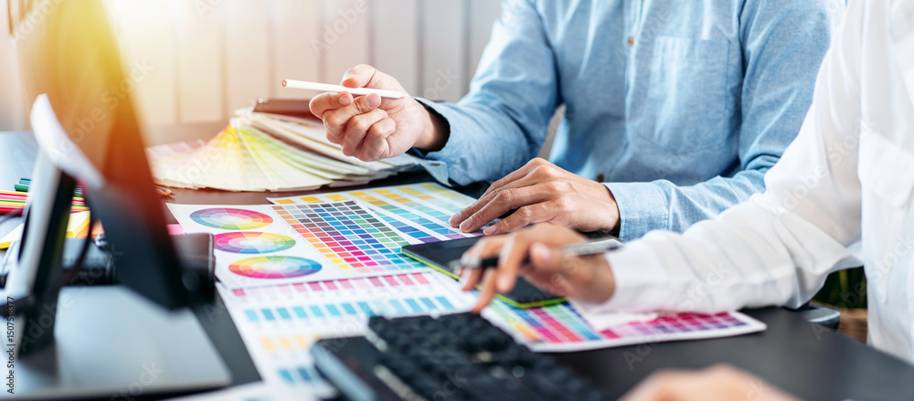 Poster team of creative graphic designer working on color swatch samples chart for selection coloring in in